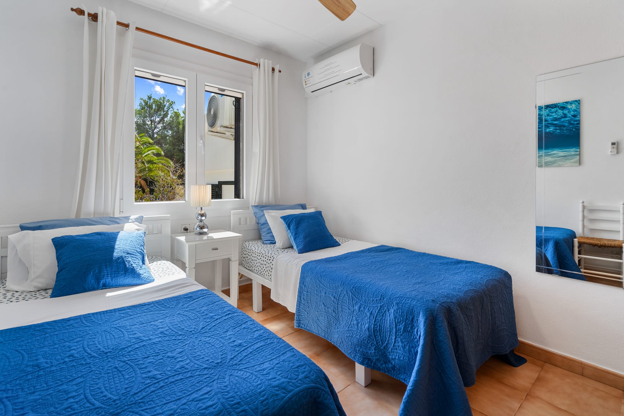 Bedroom 3.  Large fitted wardrobe. A/C & quiet ceiling fan.