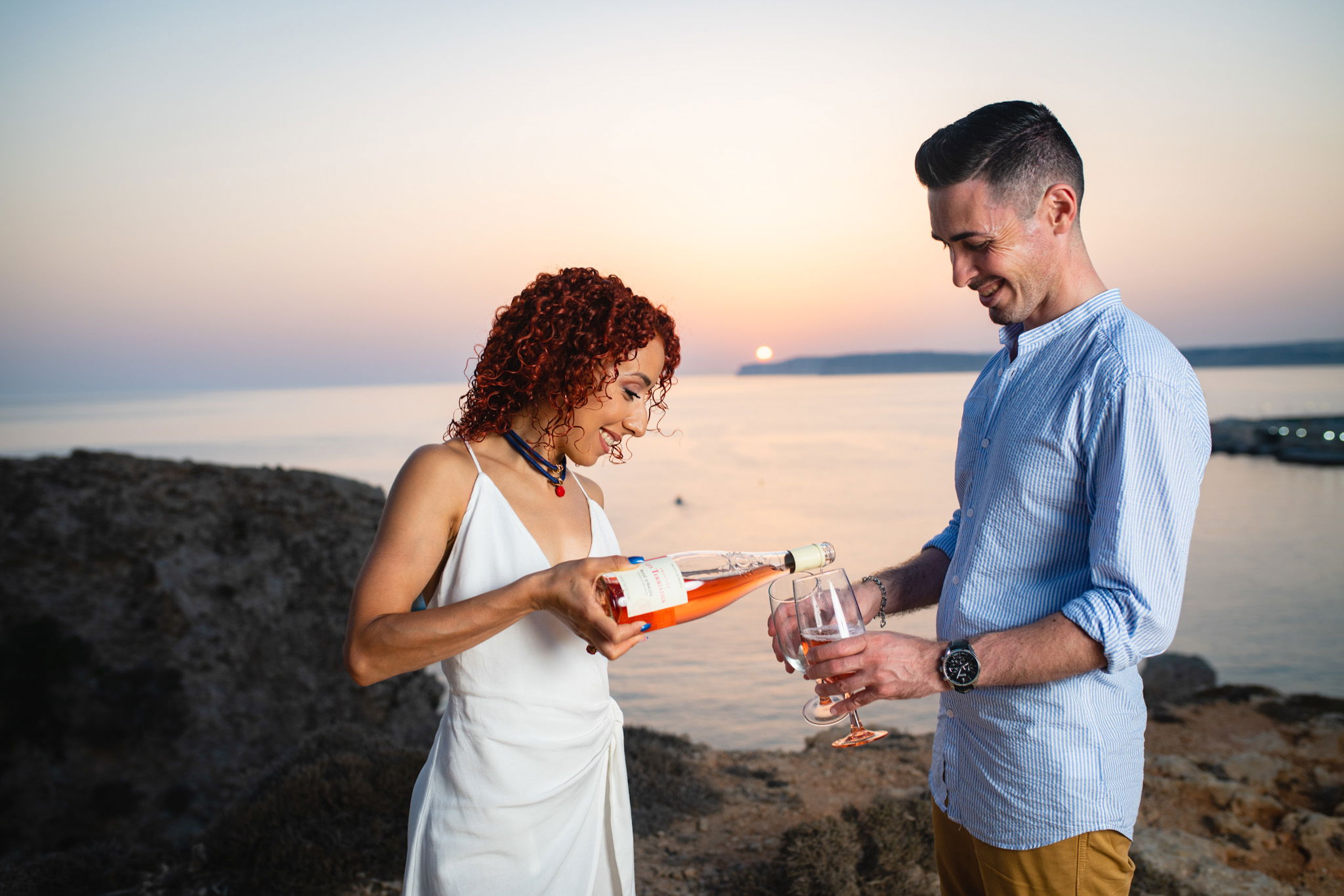 couple having wine at paradise bay