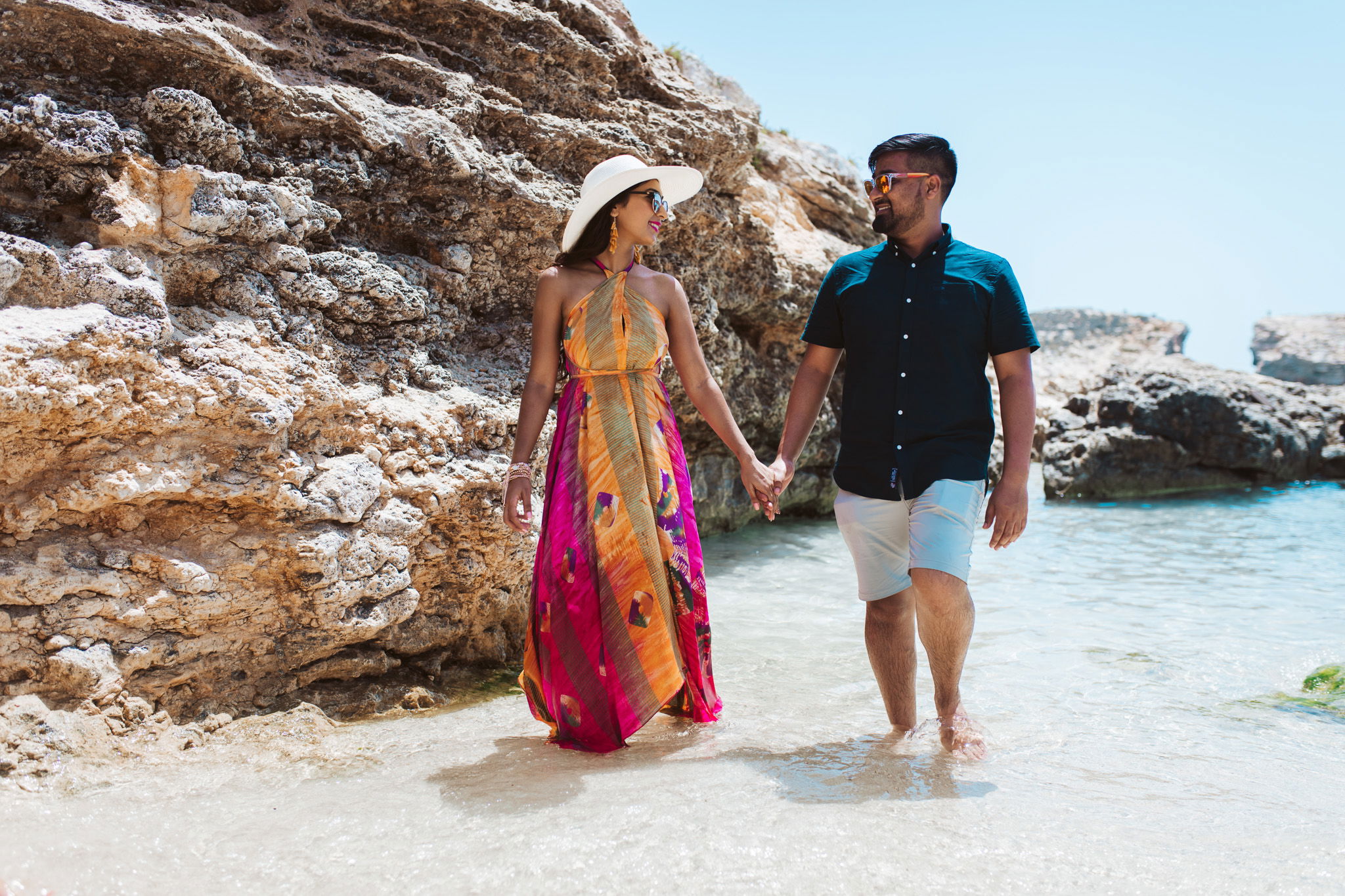 couple walking on the beach at blue lagoon