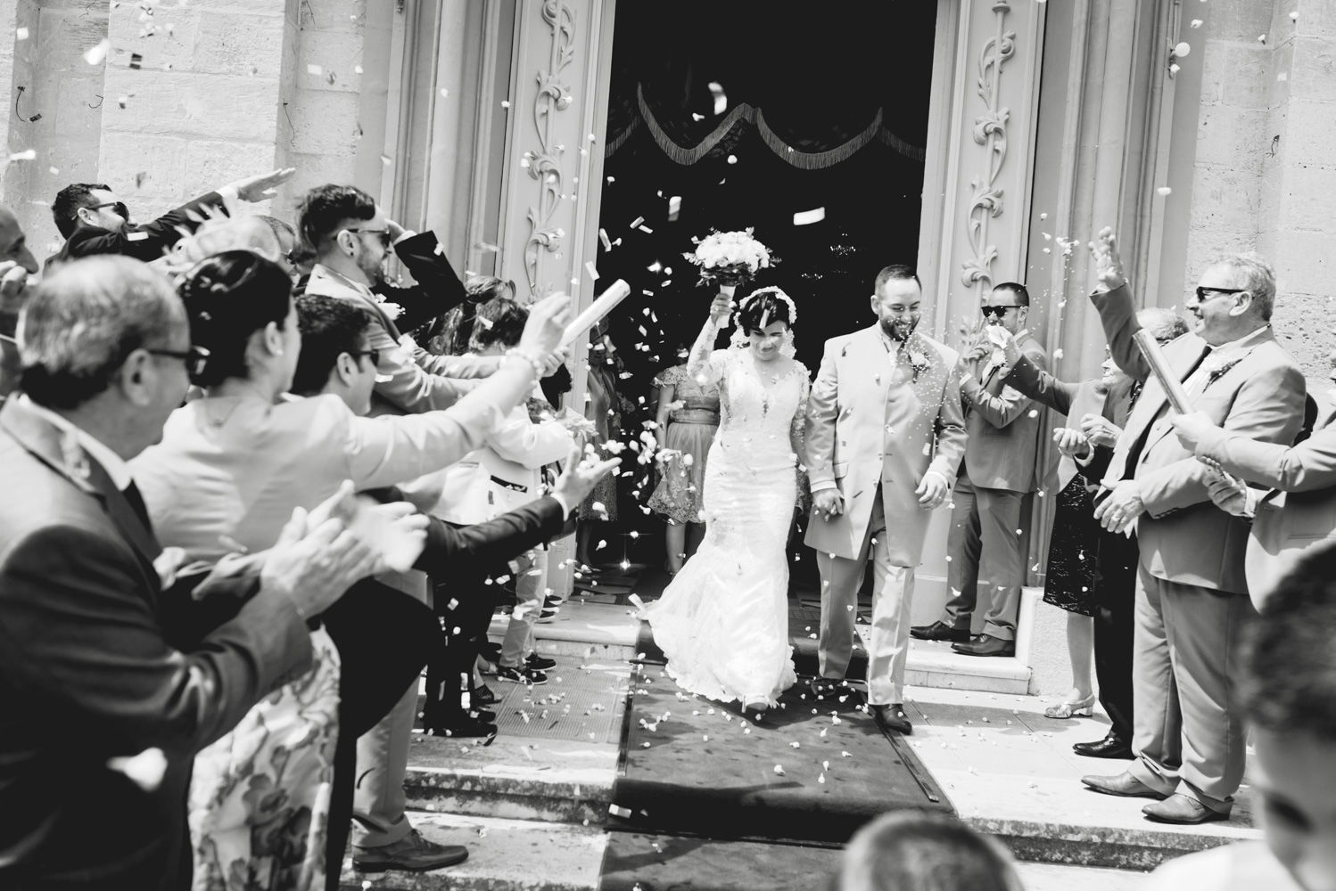 married couple walking out of couple Ghaxaq Parish Church