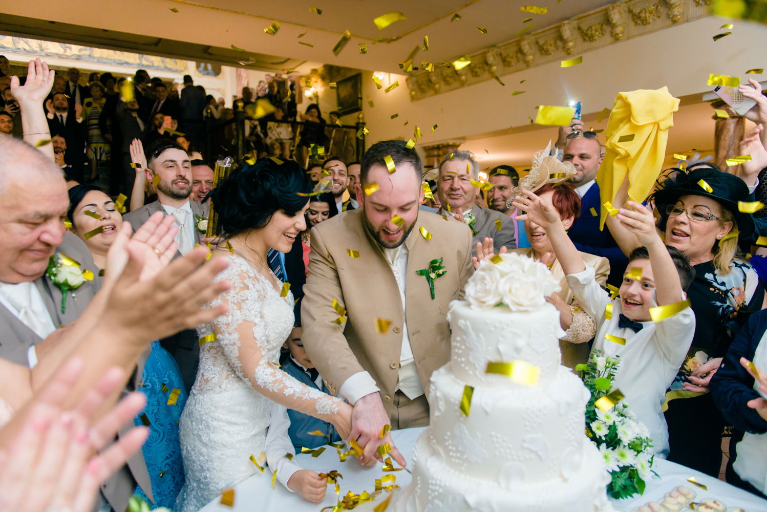 bride and groom cutting wedding cake at palazzo nobile