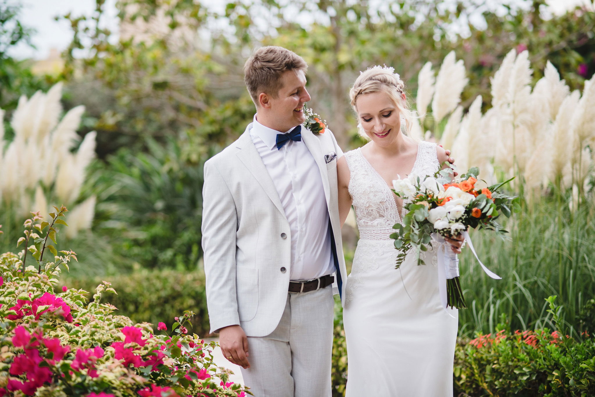 bride and groom at palazzo parisio gardens