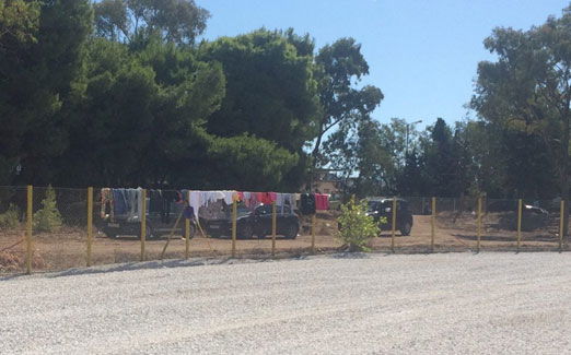 Hanged clothes on the barbed wire