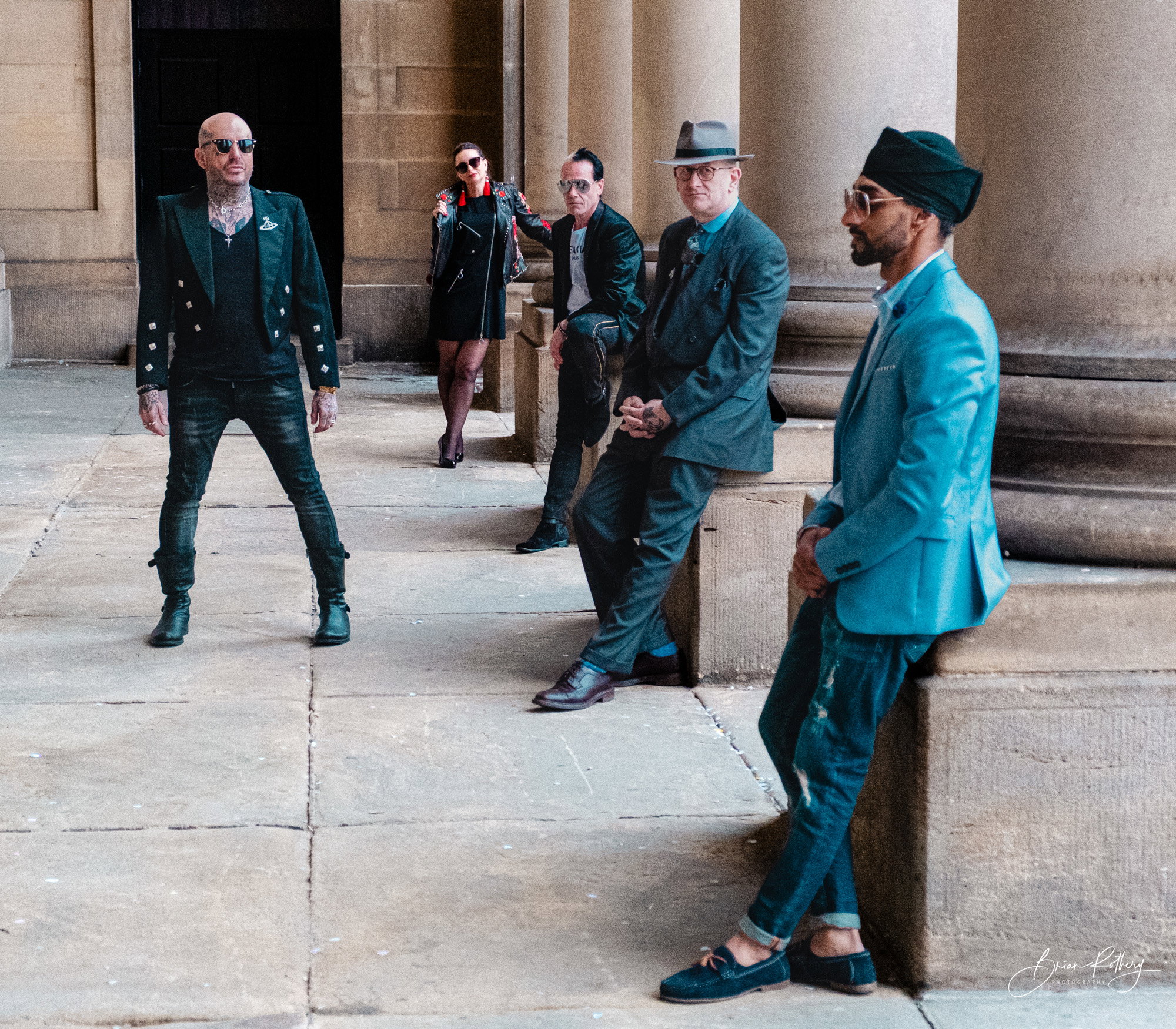 Five models against architectural background - Leeds Town Hall