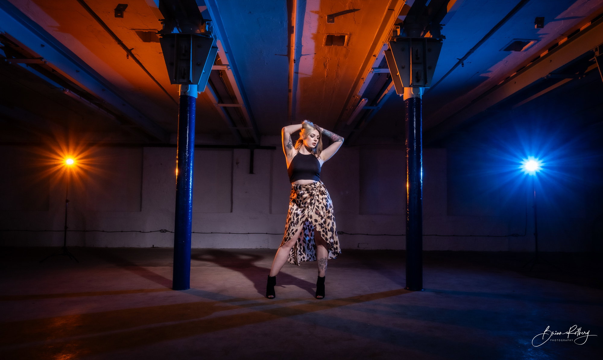 Hannah modelling in industrial mill warehouse with strong backlighting