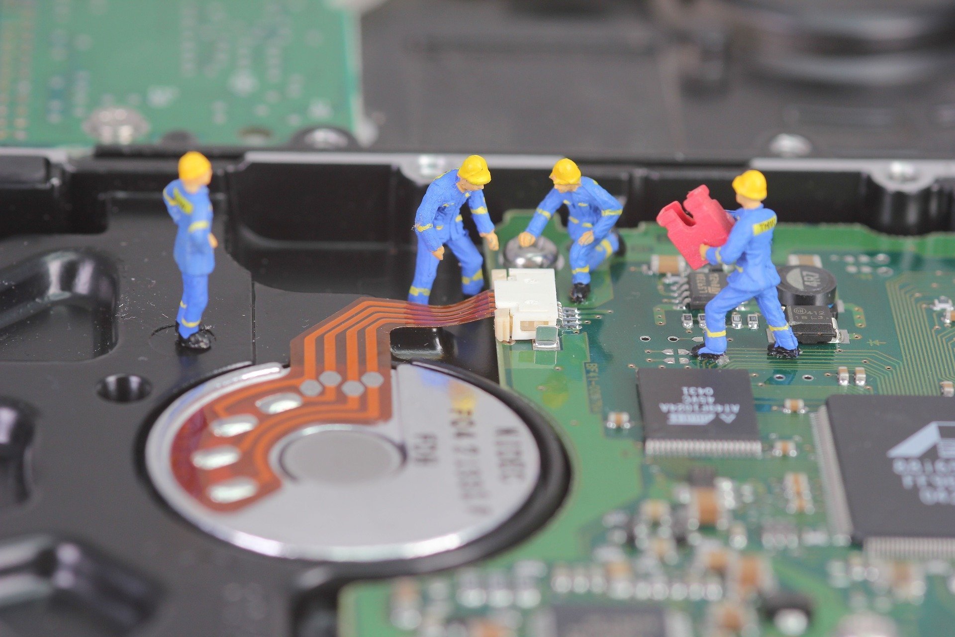 Apple technicians working on a Mac