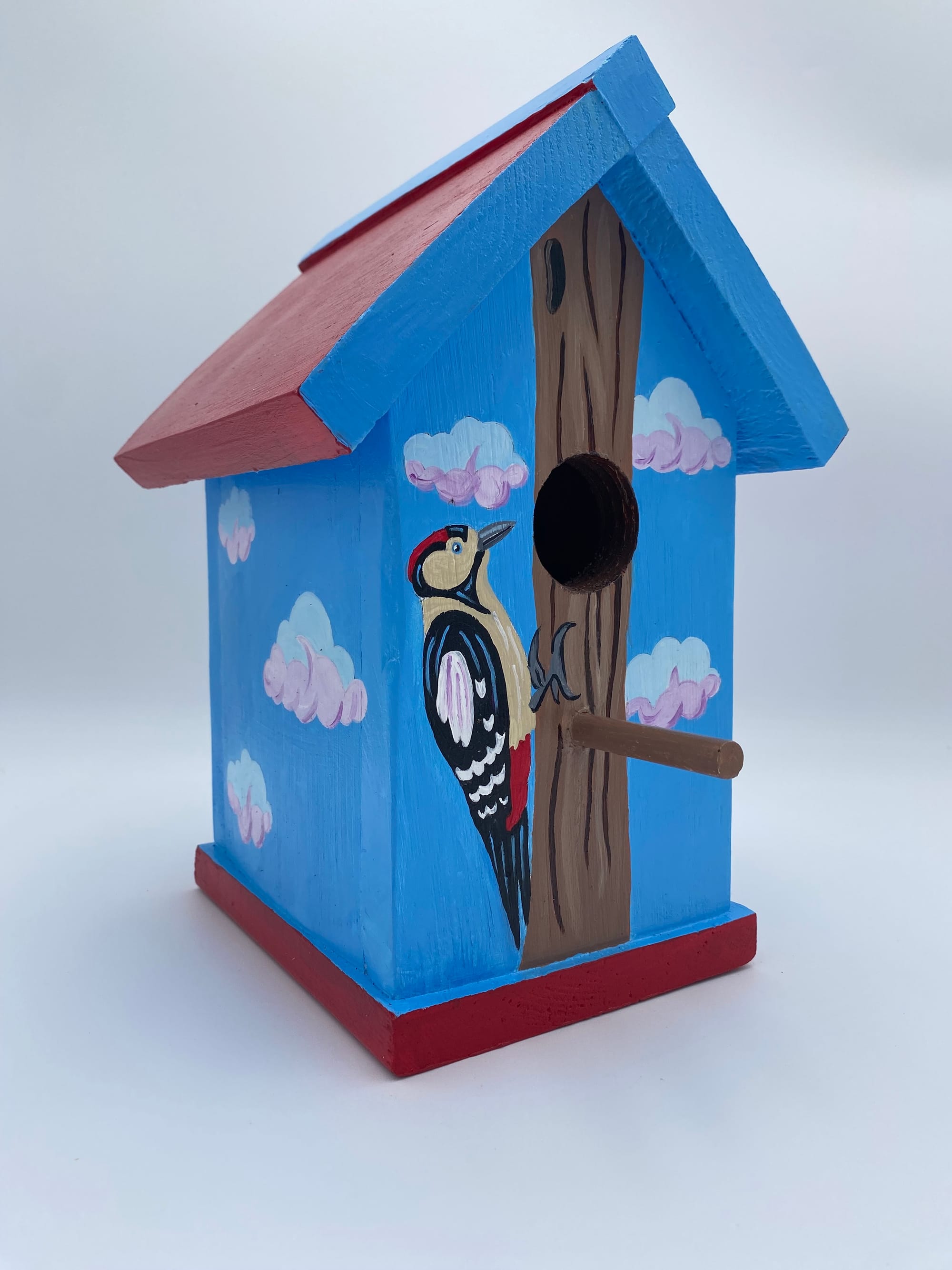 The Red-Crowned Resident Birdhouse