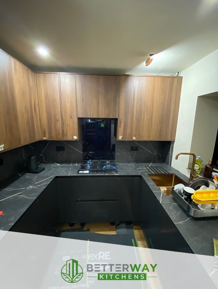 Howdens handless rail kitchen in black