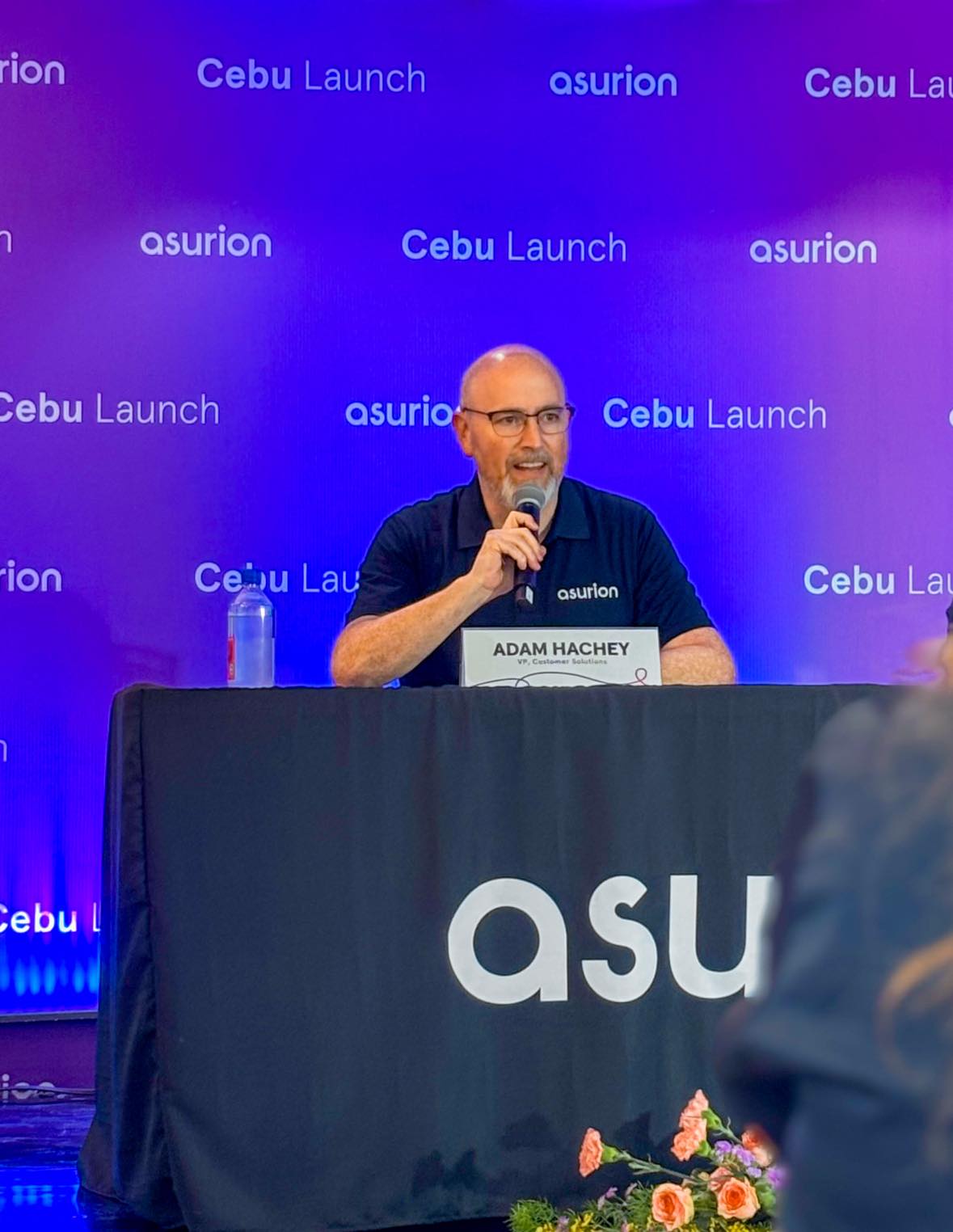 Adam Hachey, Vice President of Customer Solutions at Asurion, speaks during the Asurion Cebu launch press conference