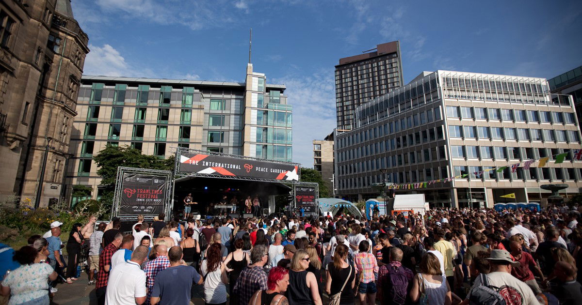 Large crowd gathered at an event in the Peace Garden, Sheffield