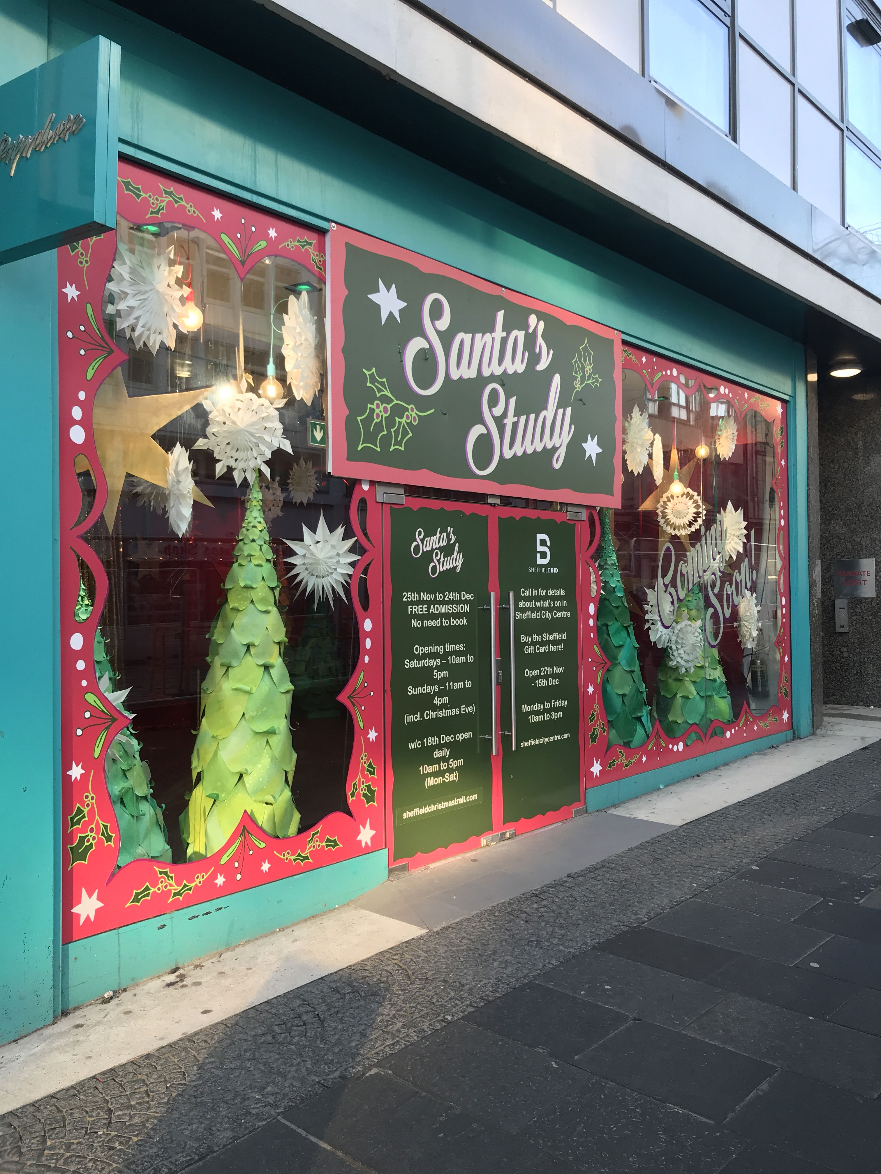 The frontage of an empty unit temporarily transformed in Santa's Study in Sheffield city centre