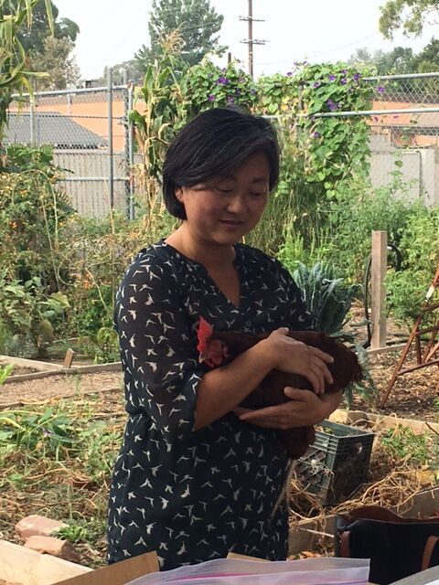 Roberta Kato and her chicken Peanut.