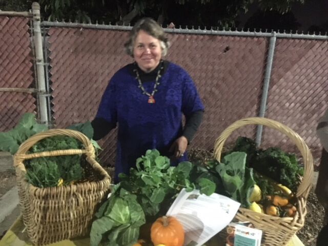 Woman displaying her produce