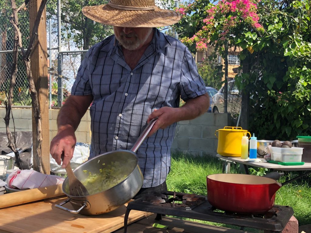 Joe Corso preparing braised leeks.