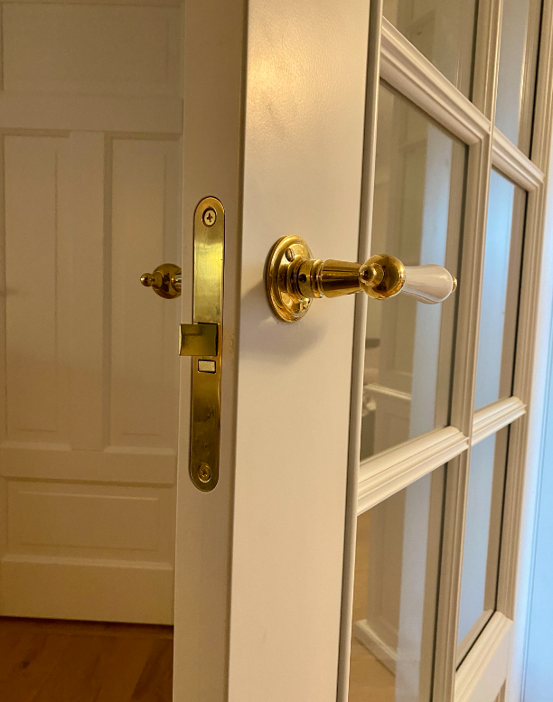 Studio Damm offers solid unpolished brass handles and hinges