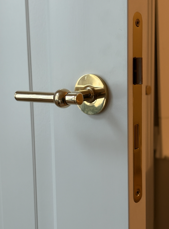Studio Damm offers solid unpolished brass handles and hinges