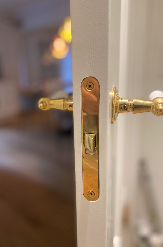 Studio Damm offers solid unpolished brass handles and hinges
