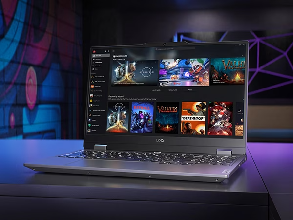 Lenovo LOQ 15IRX9 gaming laptop on a table, with Xbox Game Pass menu on the display