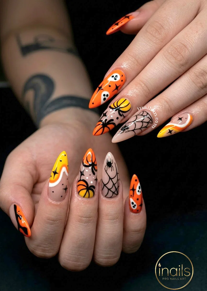 Matte black celestial Halloween nails with gold chrome spiderwebs and moons