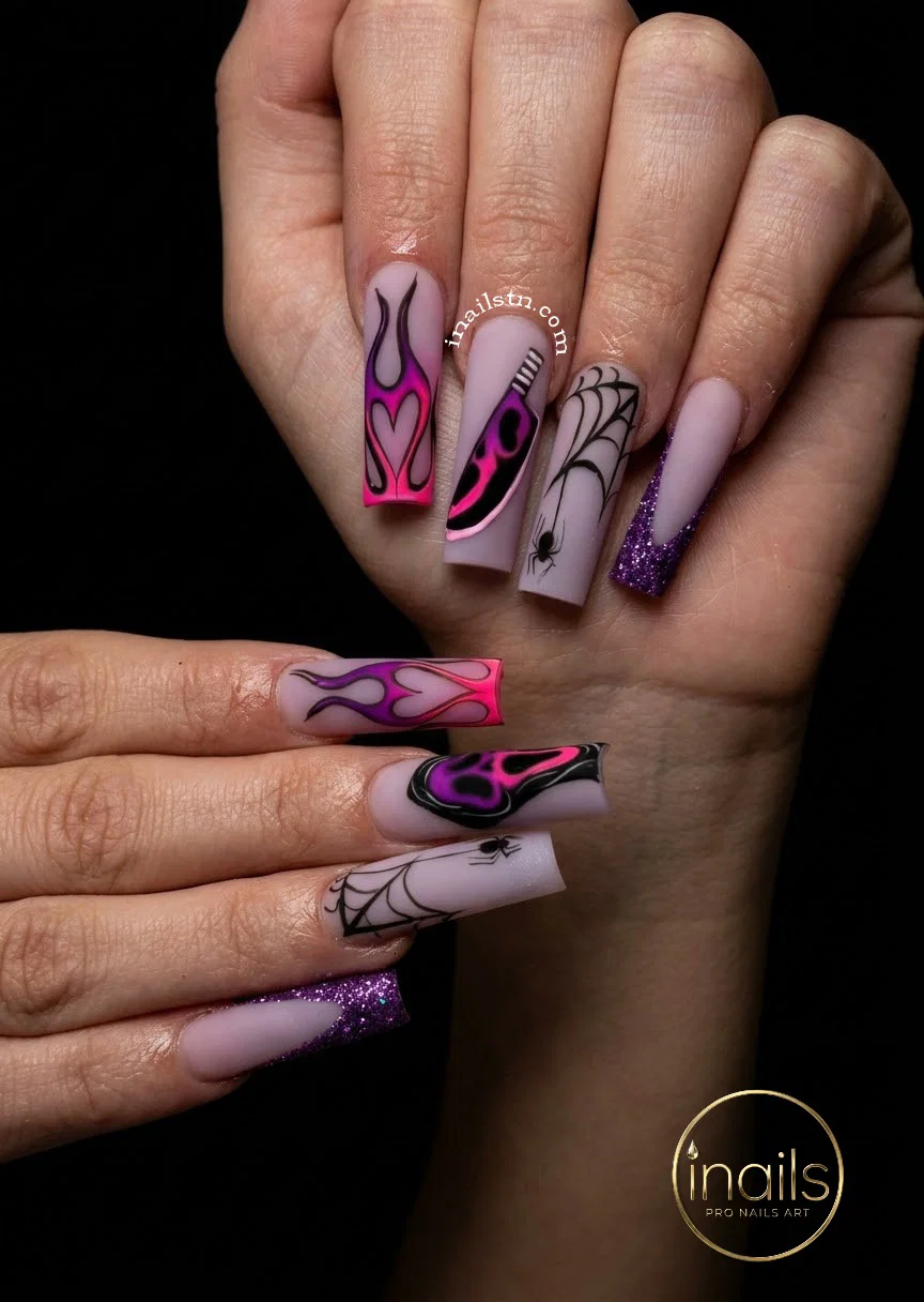 Amber tortoiseshell Halloween manicure with subtle Jack-o-lantern nail art