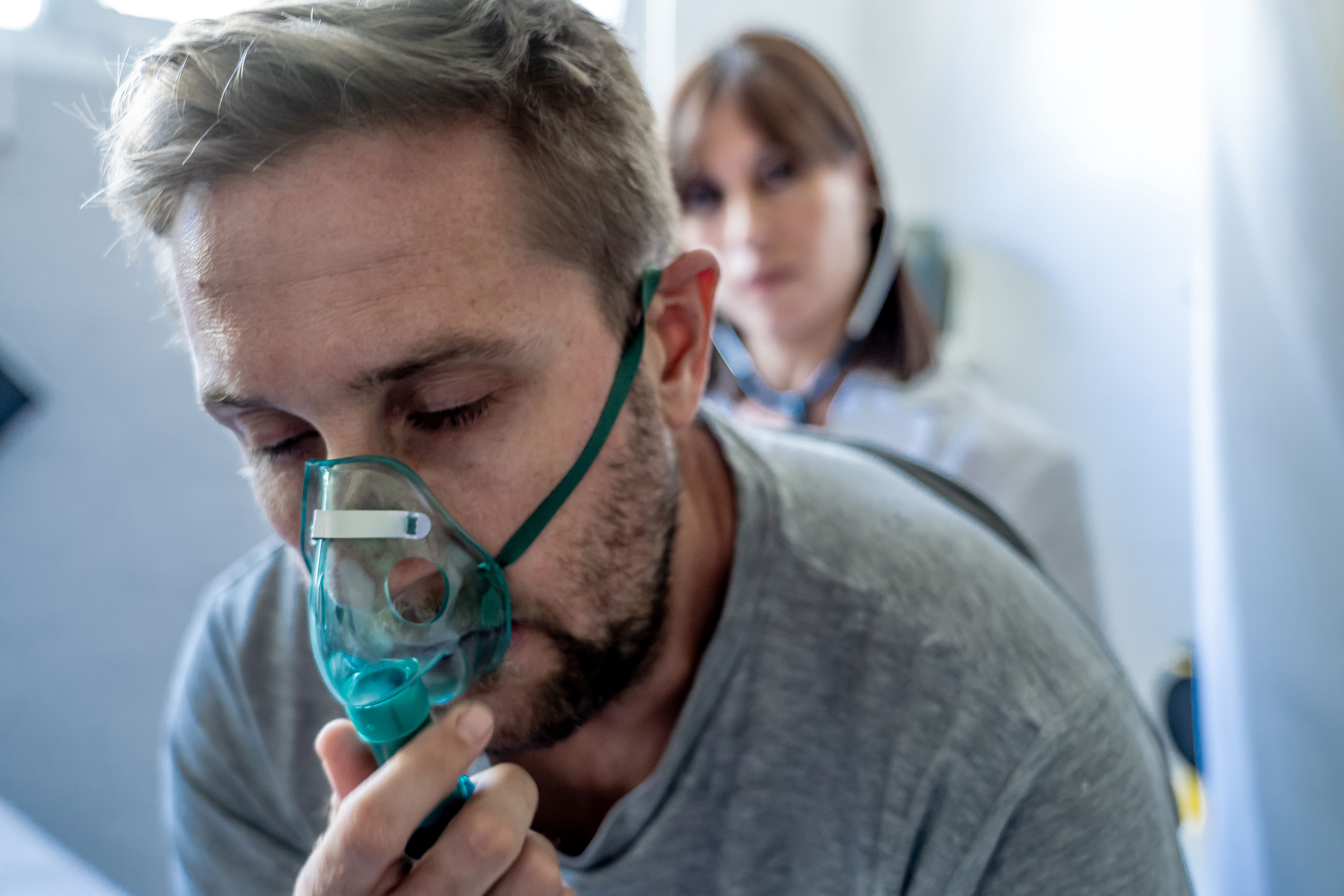 sick asthmatic person in hospital with Doctor