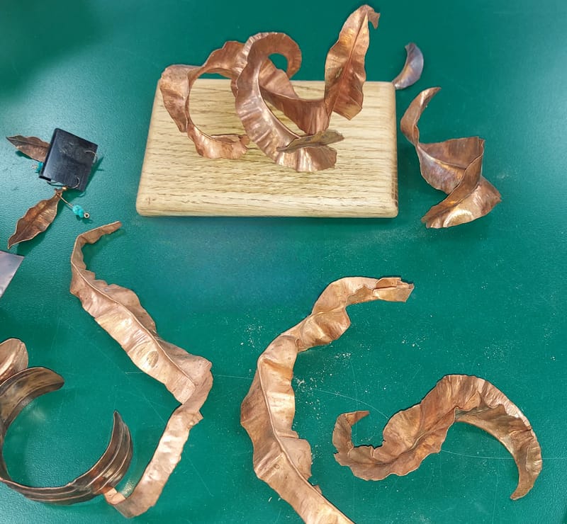 T-Fold/in-line Fold metals