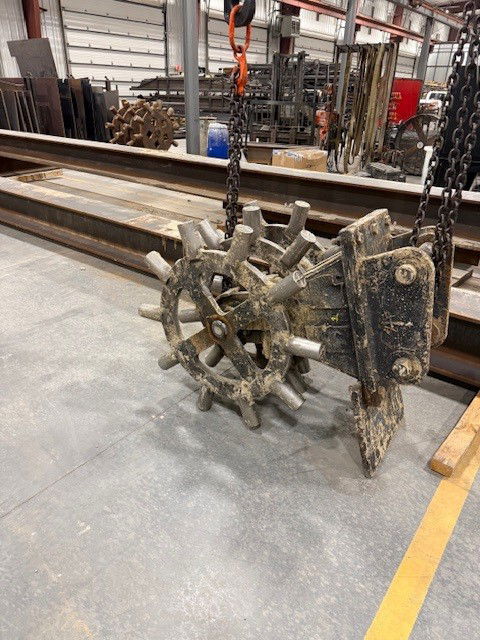 Broken shaft from a compaction wheel