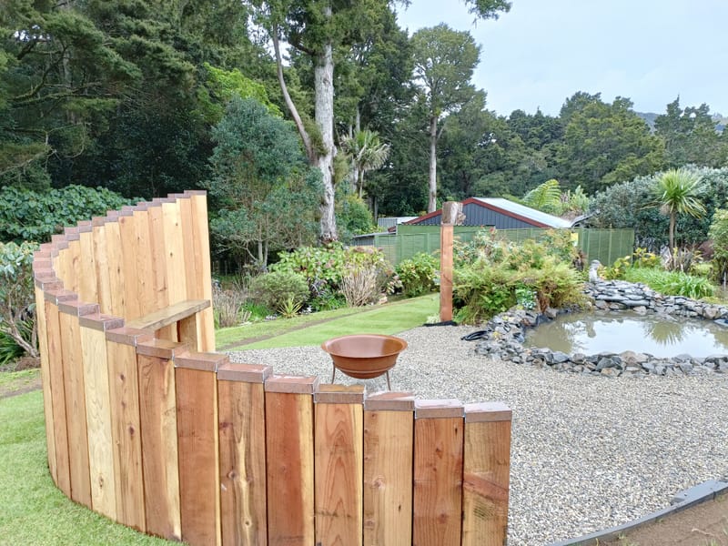 Vertical Timber Sleeper Wall and Firepit Area