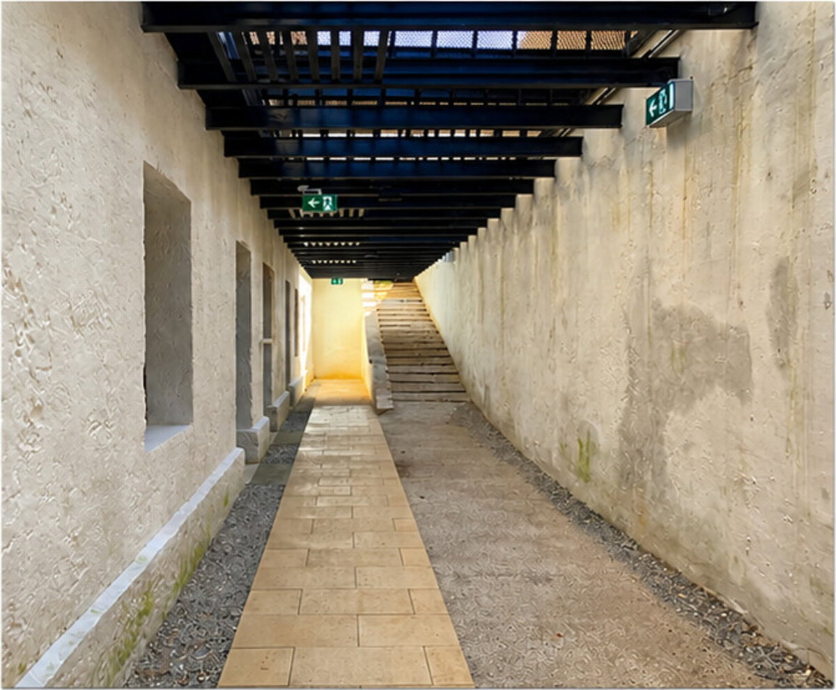 Interior walkway at Fremantle Prison showing cable tray installation