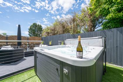 Outside: Patio and Hot Tub, Private Parking