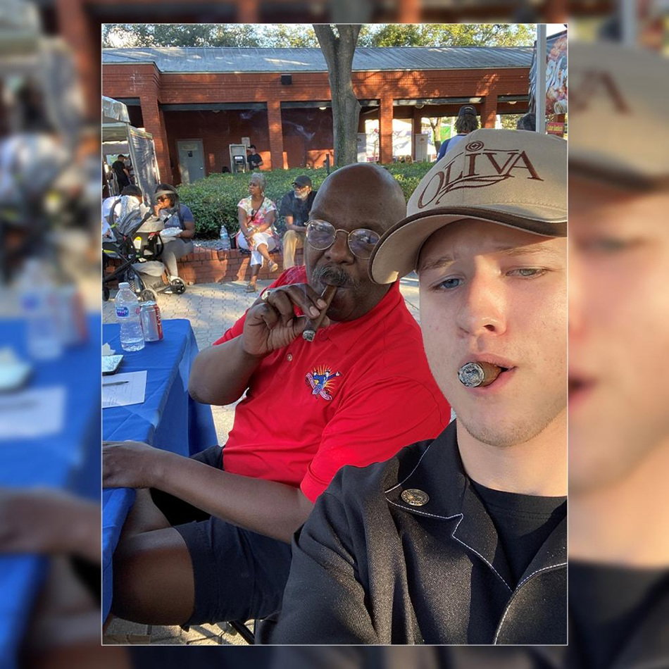 Cory Carnley Taking an Outdoor Cigar Selfie