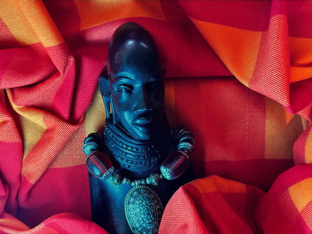 Female Masai warrior in red Masai blanket