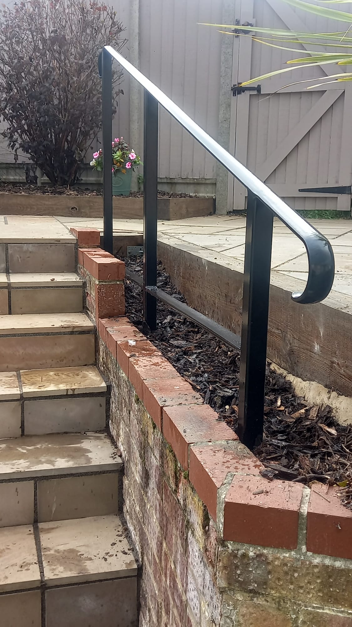 Handrail to raised patio