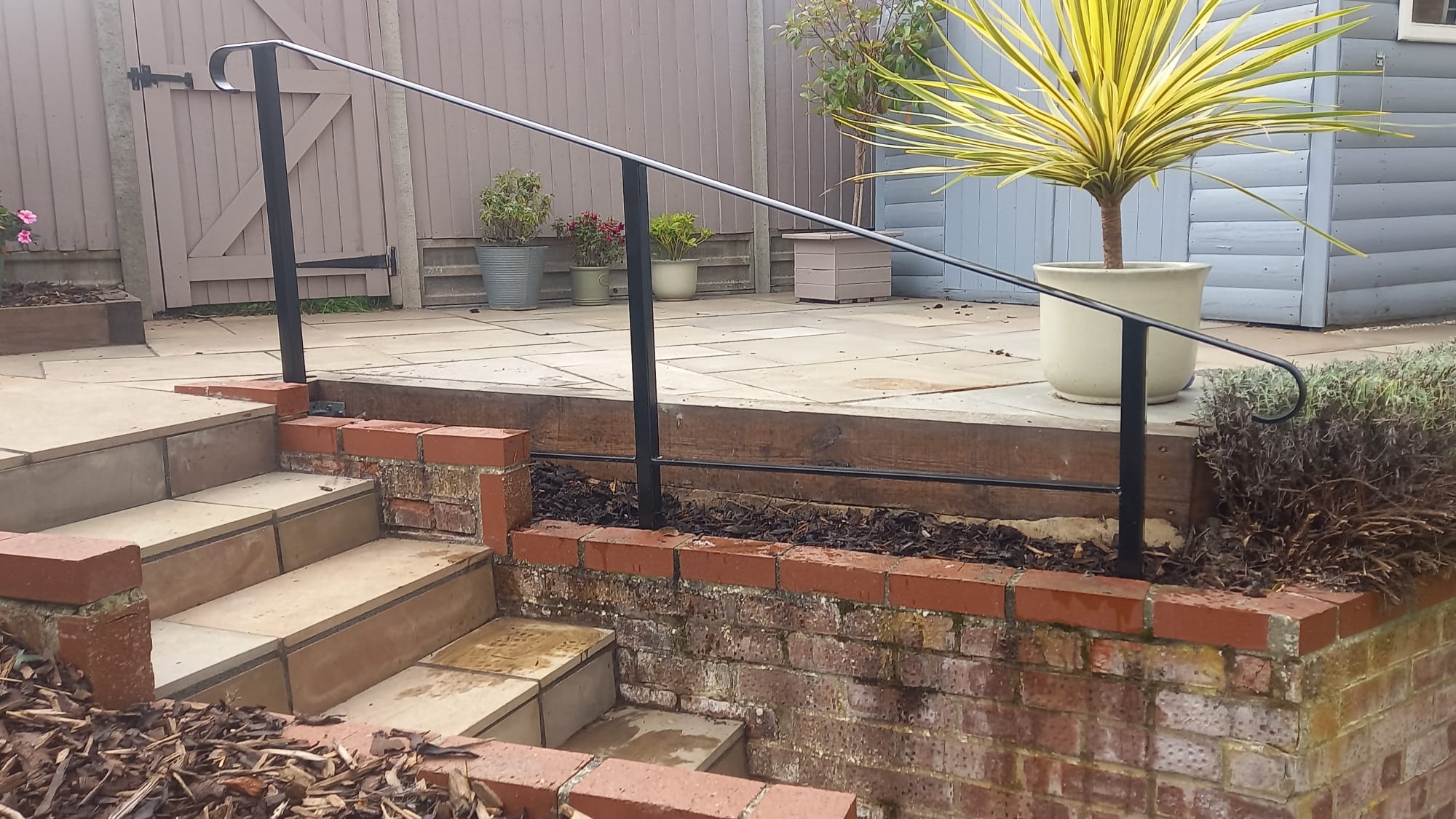 Handrail to raised patio