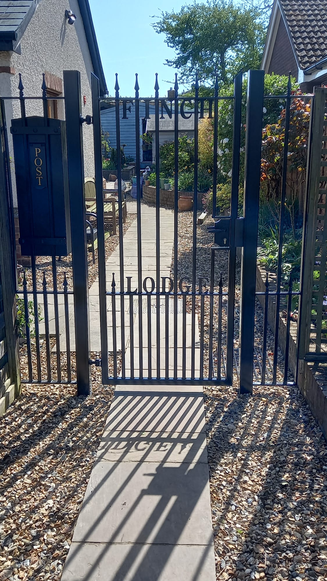 Named Gate with railing and postbox