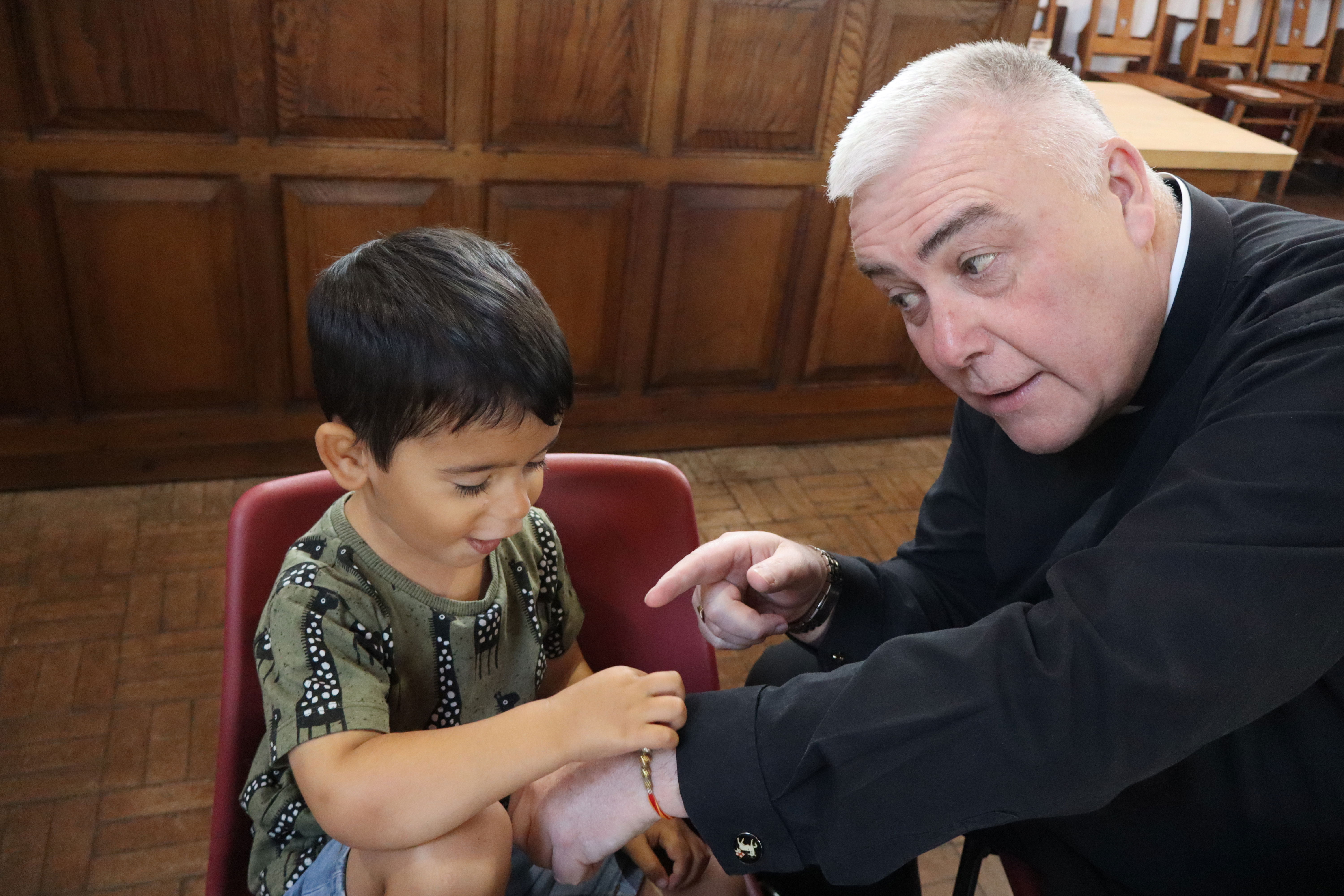 Rajendra tied rakhi for his friend and TCfR Chair, Rev. Steve Holt