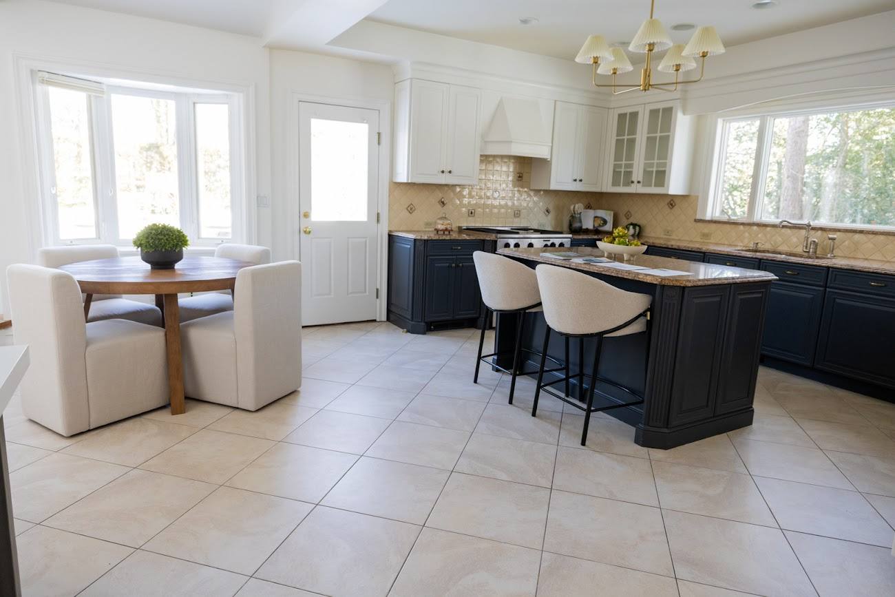 Staged kitchen in a Westchester home with layered lighting