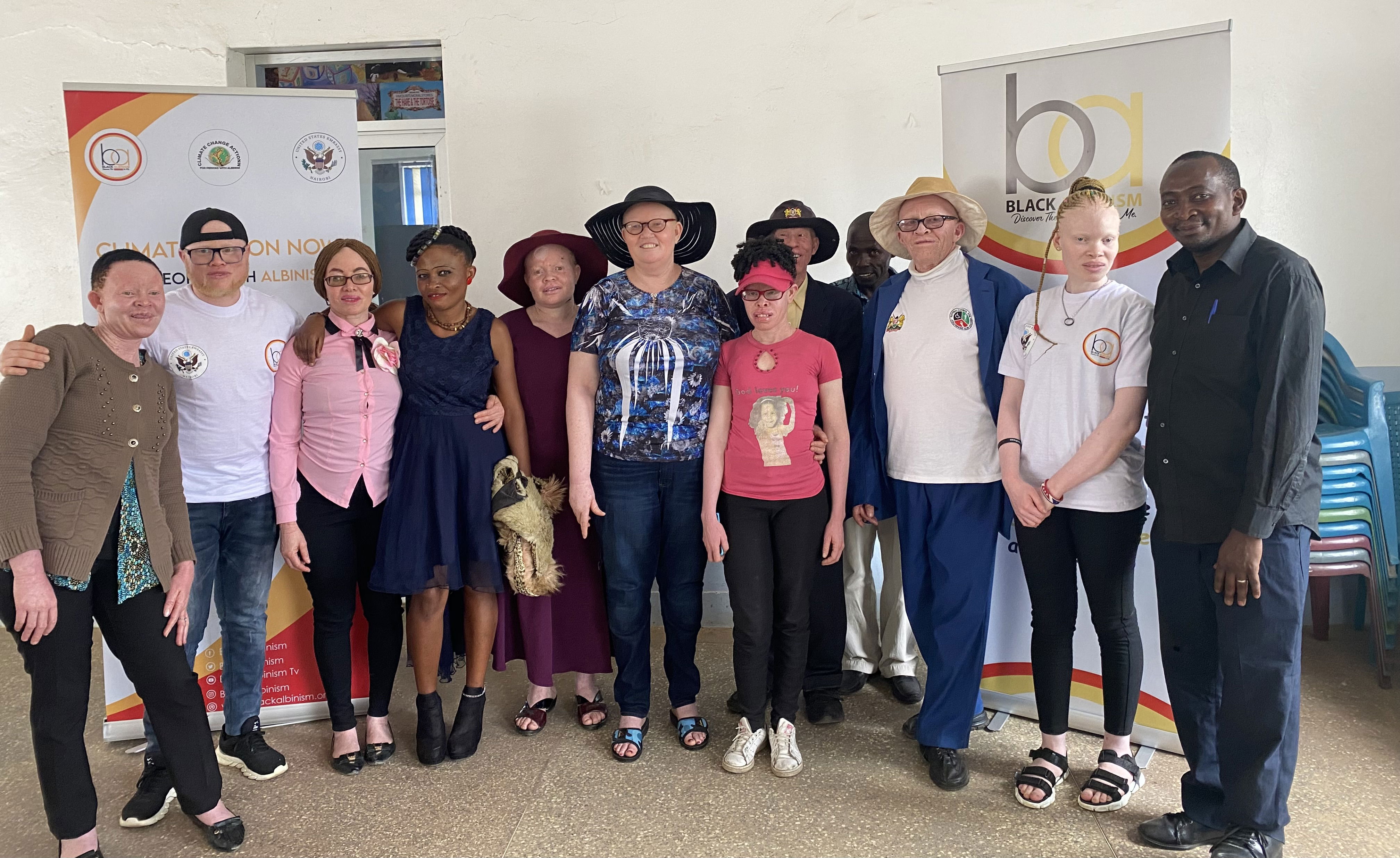 Persons with albinism and parents of children with albinism pose for a picture after a focus discussion group in Machakos County.