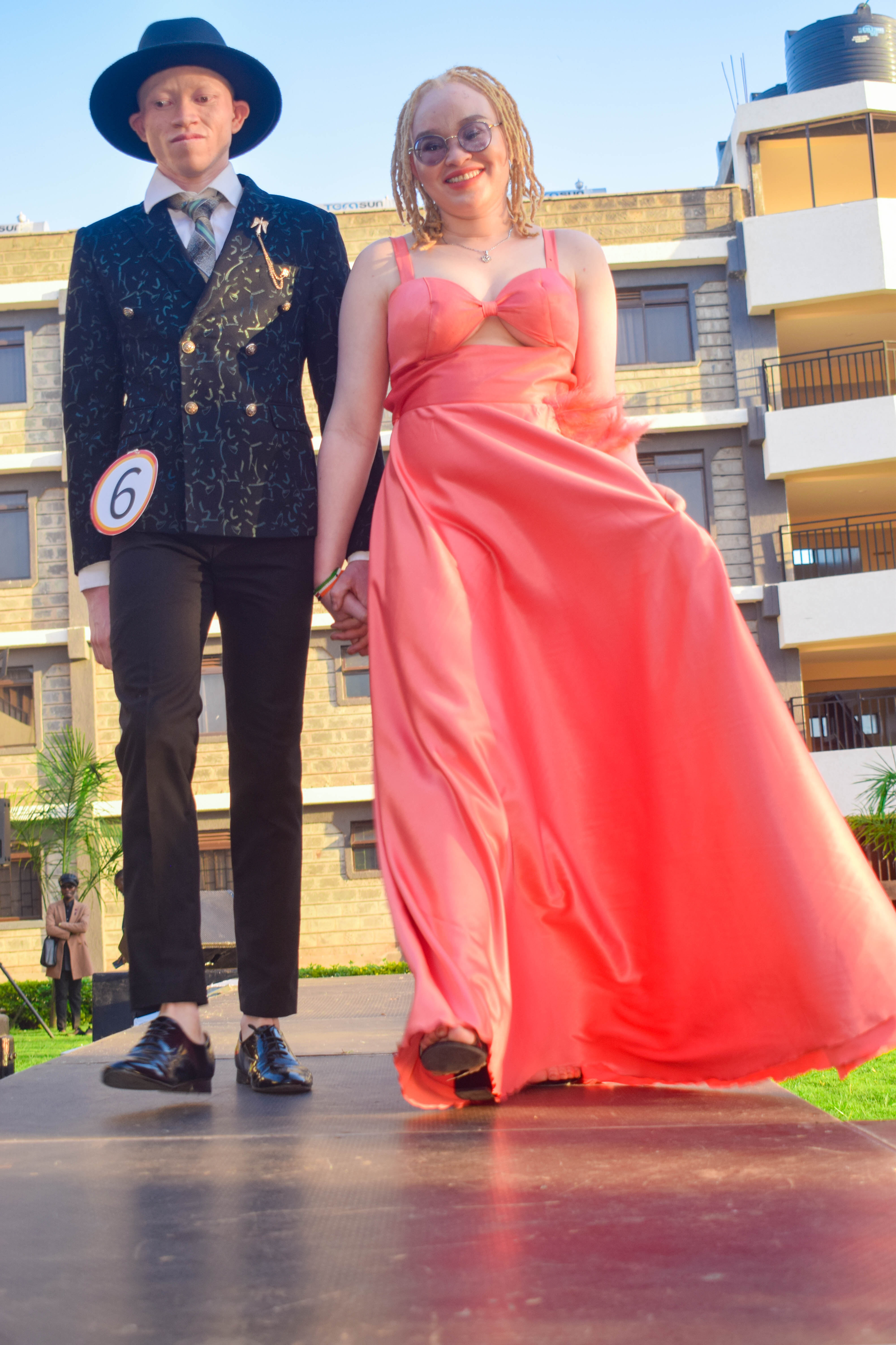 Dinner wear outfits. Male and Female walking hand in hand.