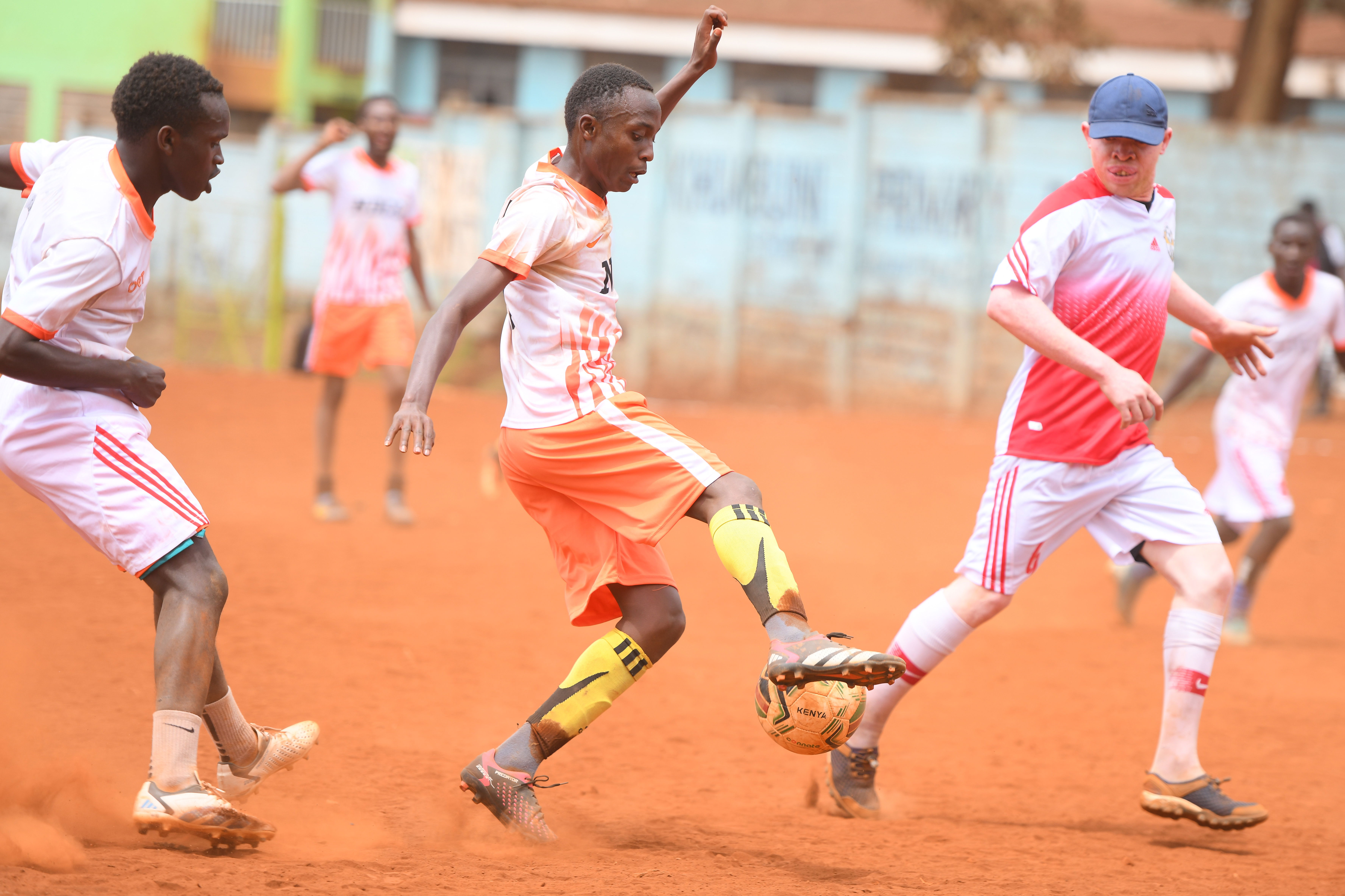 Lion Stars dribbles the ball past a BlackAlbinism fc player