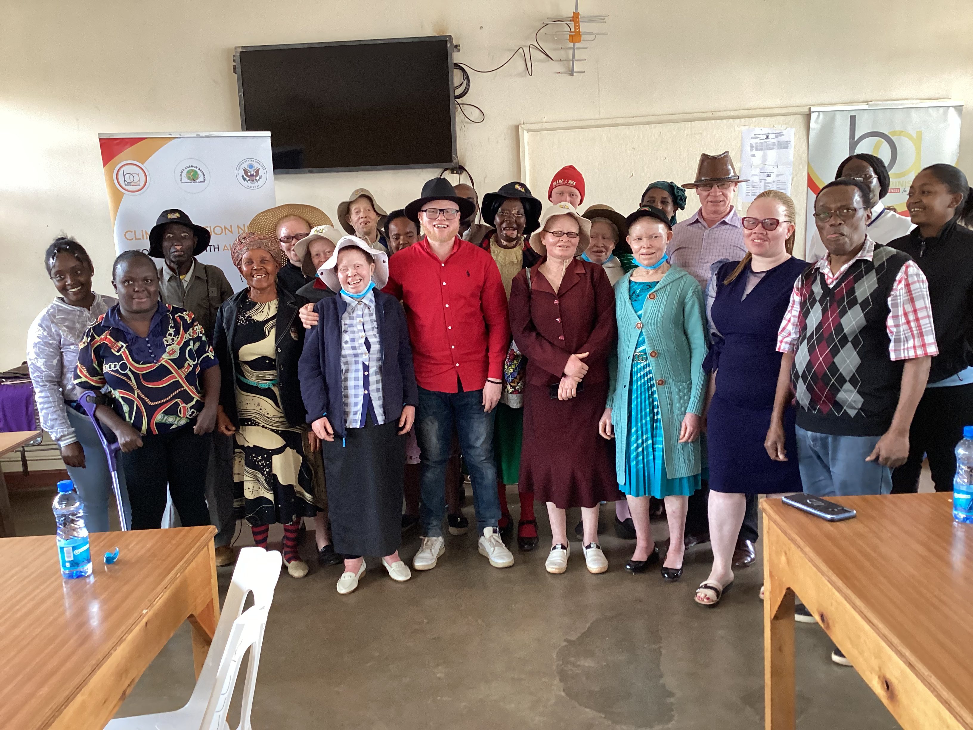 Group photo of Persons with Albinism, Persons with Vitiligo, parents and friend of Persons with Albinism.