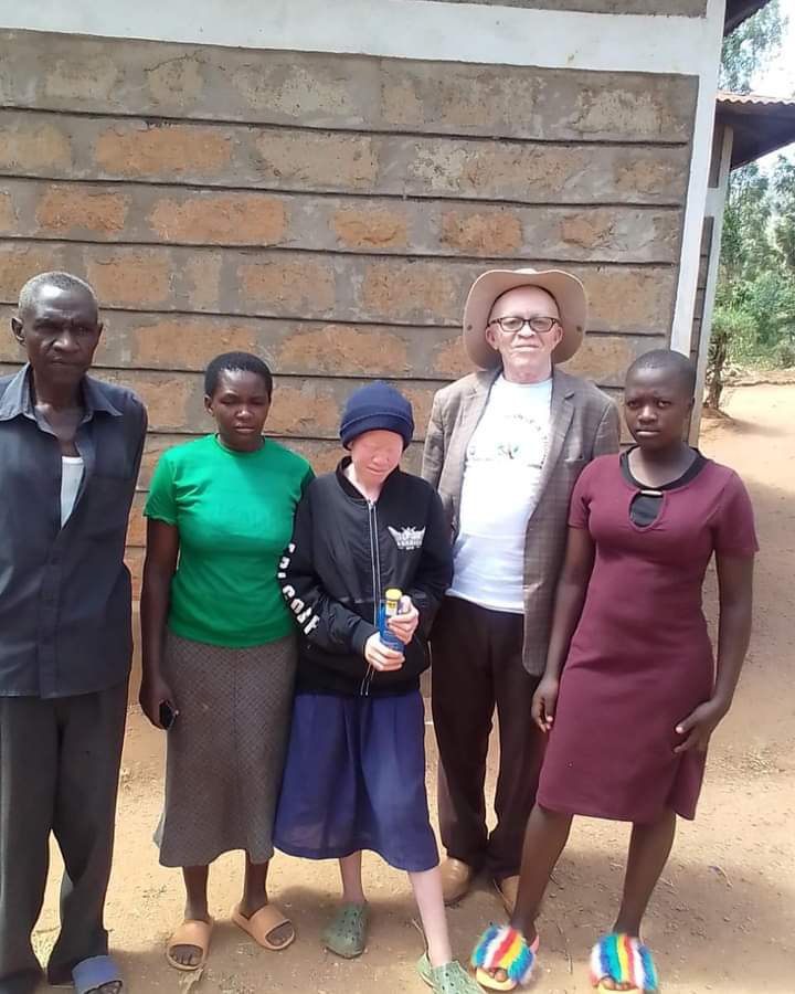 A group of persons in a village during an outreach to create awareness.