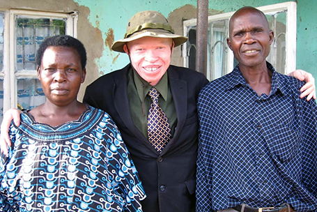 A picture of Peter Ogik and his parents