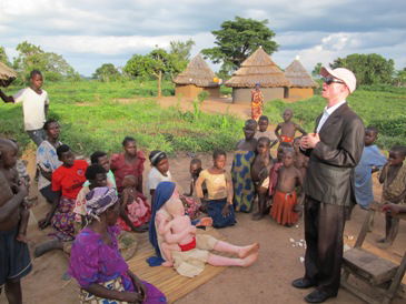 A picture of Peter Ogik creating awareness in Busoga, Uganda.