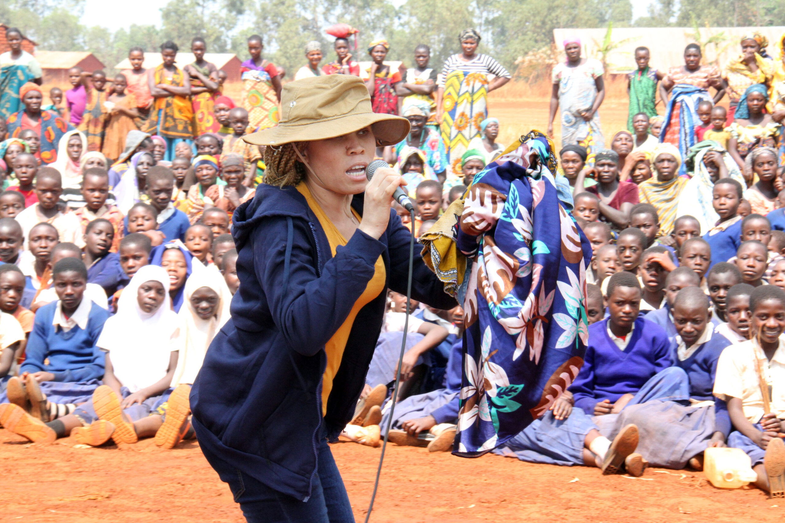 A lady with albinism educating students about albinism