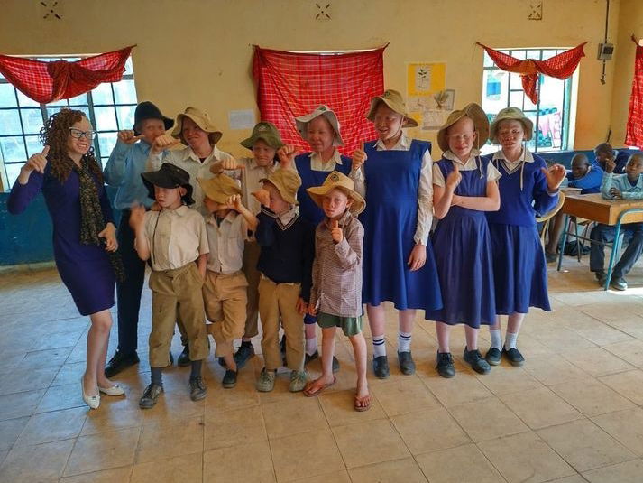 A picture of our climate change champion in Kitui, Faith Joseph and some learners with albinism in the county