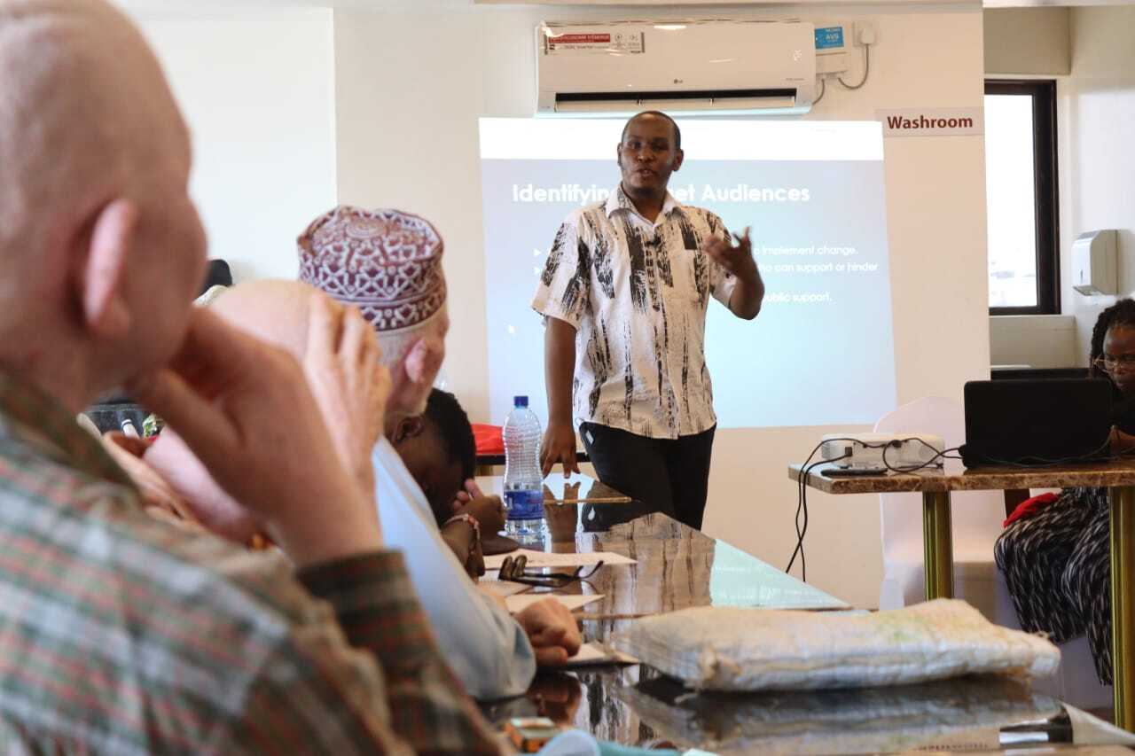 A picture of Boniface Mirikiwa, our project officer training on Advocacy