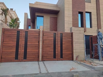 تنفيذ أعمال كلادنج وأبواب كلادنج لفيلا بحي الملقا في الرياض