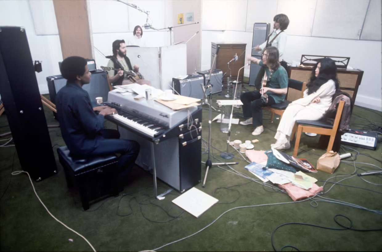 The Beatles with Billy Preston and Yoko Ono in the recording studio at 3 Savile Row. Photograph: Ethan A Russell / © Apple Corps Ltd