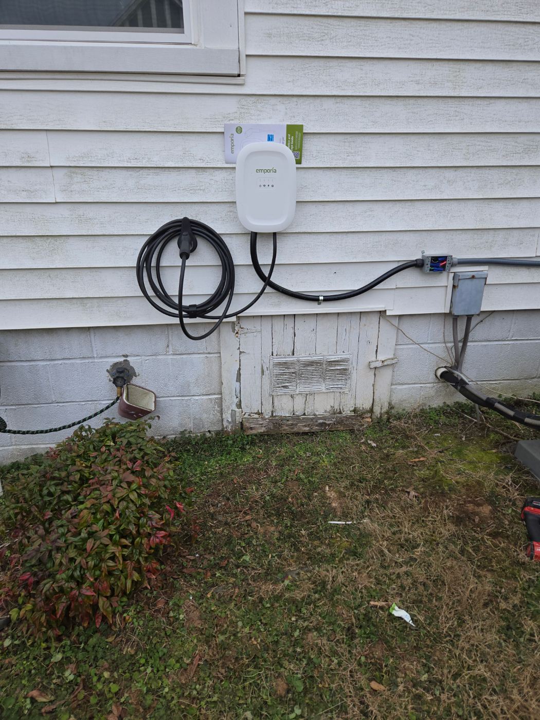 Exterior EV charger installed on a home by Stickler’s Electrical Service, electrician serving Mountain View, NC